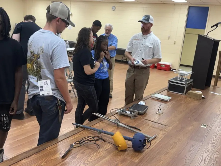 A CU-CAT agricultural technology demonstration with students.