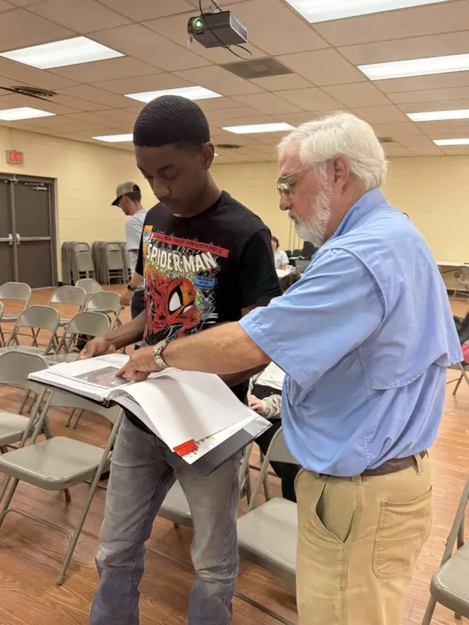 A participant takes part in a CU-CAT agricultural technology outreach activity.